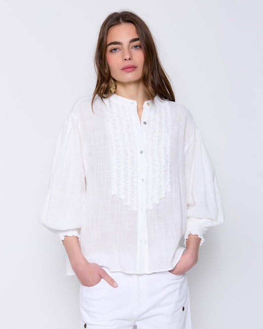 Blouse with ruffles on the chest in white